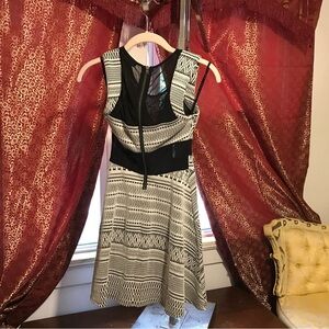 Black and White pattern Women’s dress. Mesh on the sides.